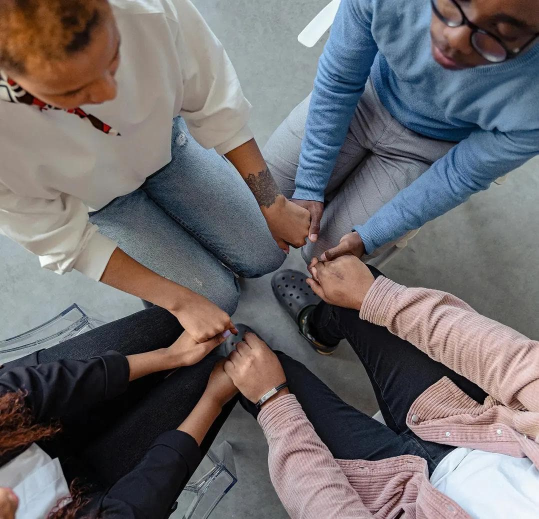 Hands joined together in a circle
